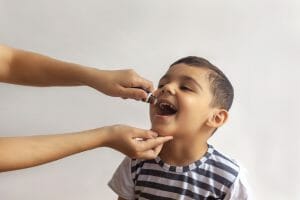 photo of child getting oral vaccine